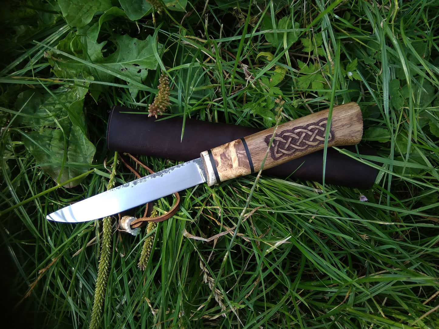 Small knife with leather sheath